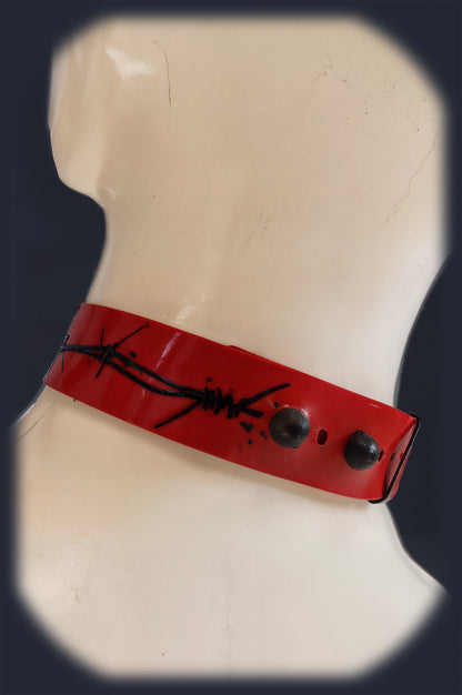 Red latex collar laid flat showing the stretchable band