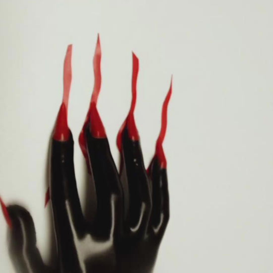 Video — black latex glove with long red latex nails
