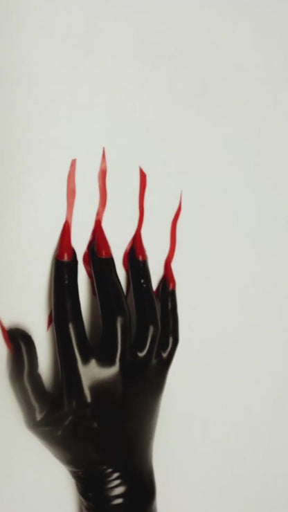 Video — black latex glove with long red latex nails